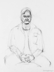 A man with clasped hands